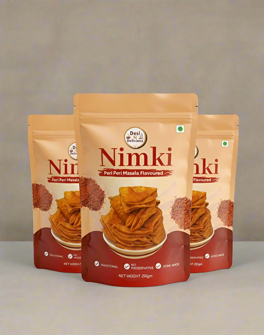Three packages of Nimki snacks on a gray background